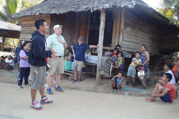 Photo above shows Missionary Blake along with Miss Belle and her husband, sharing the love of God in the village of Mowah Kee, Thailand.